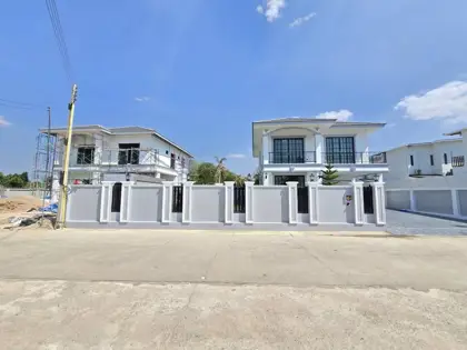 Two-story house with swimming pool for sale.