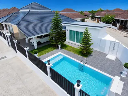 Single-story house for sale with private swimming pool.